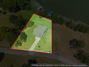 Aerial showing approximate property boundaries at 7581 E Lake Drive