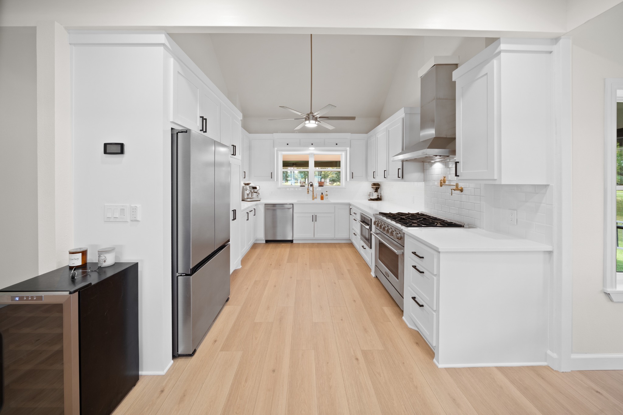 Bright white kitchen with professional gas range