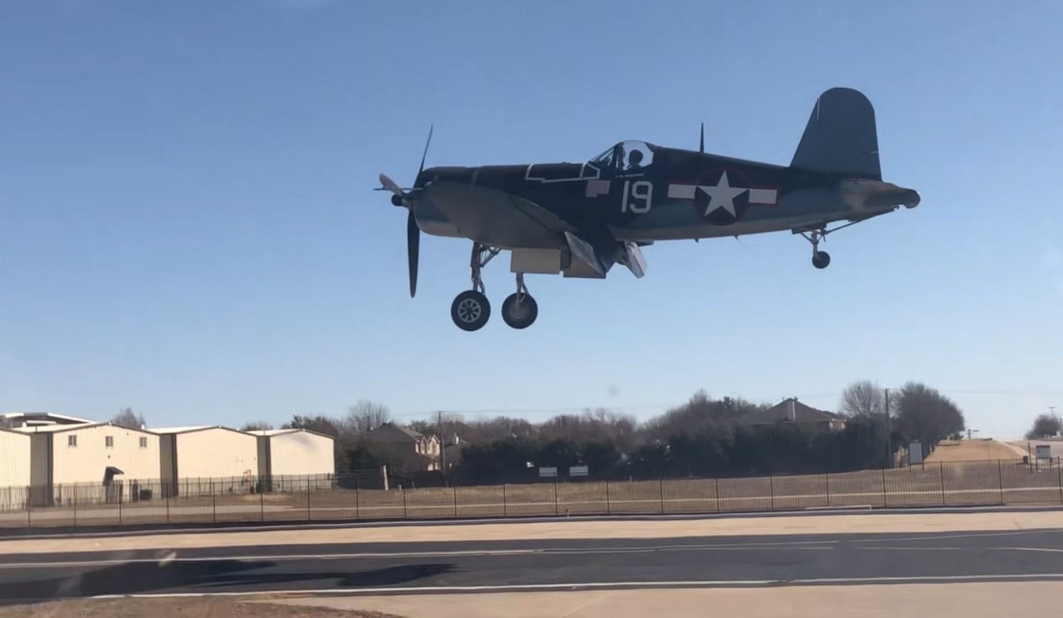 Warbird arriving over the runway at Aero Country Airport