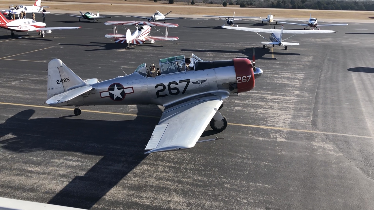 Warbird and general aviation aircraft gathered at an Airplanes and Coffee event