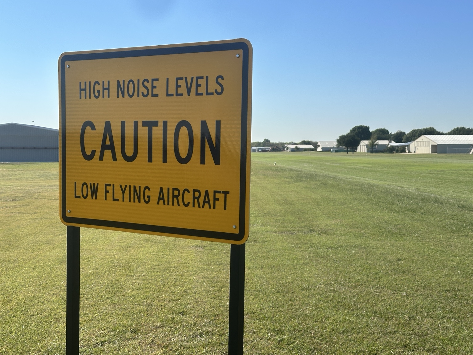 High noise levels and low flying aircraft caution sign beside the Fairview runway