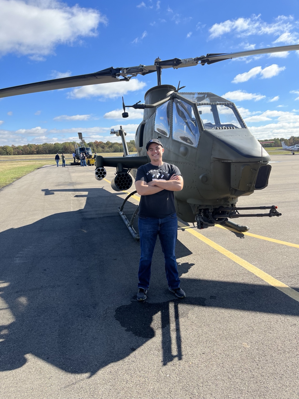 John Naugle with an AH-1 Cobra helicopter
