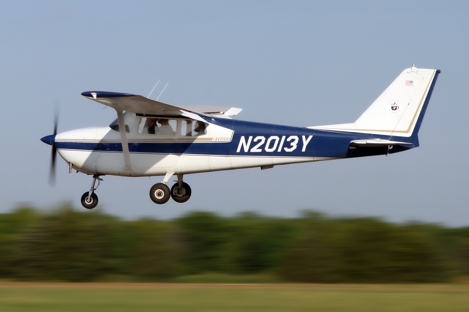 John Naugle flying in a blue and white Cessna 172