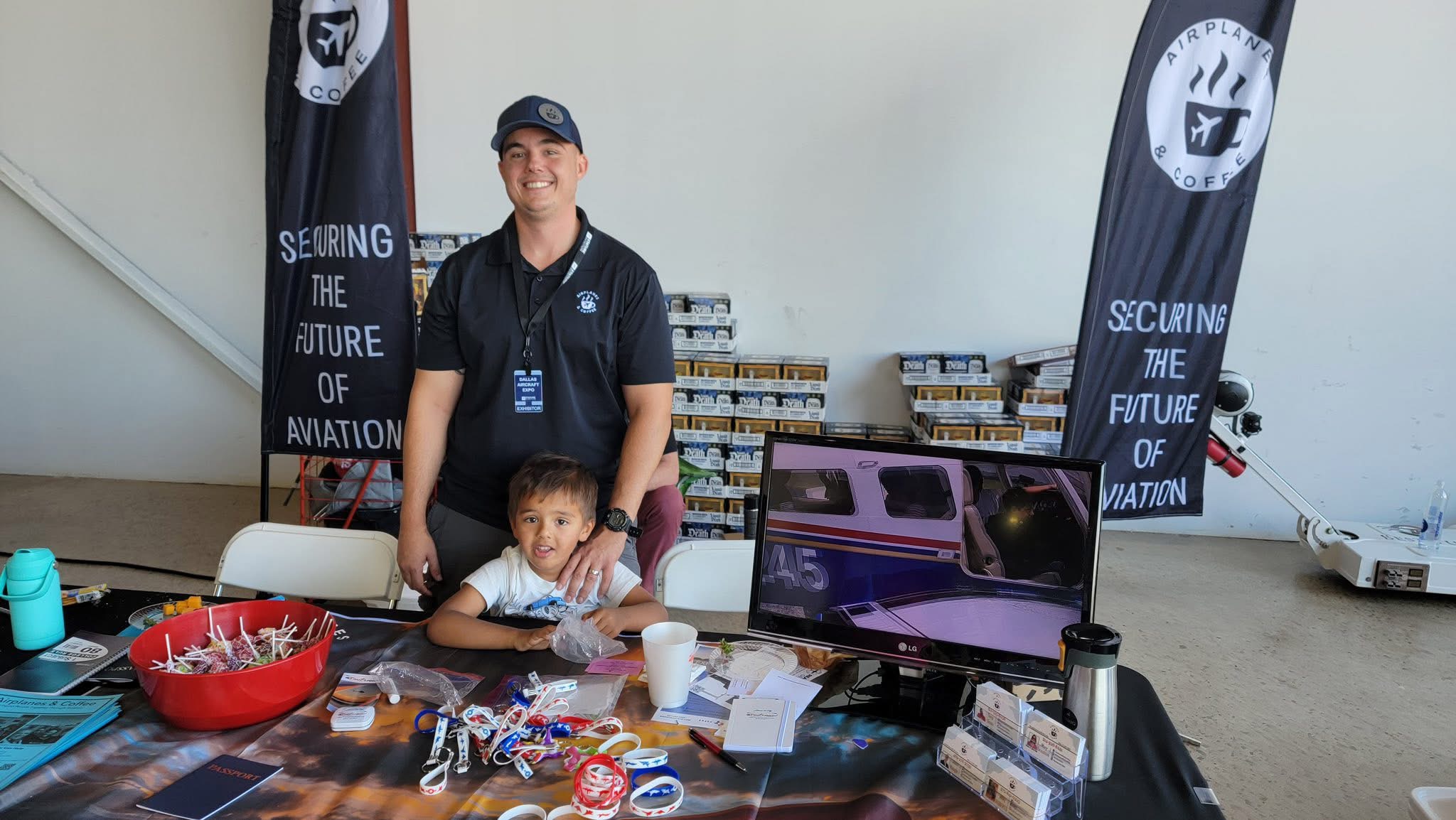 John Naugle and his son Rohan working at the Airplanes and Coffee booth